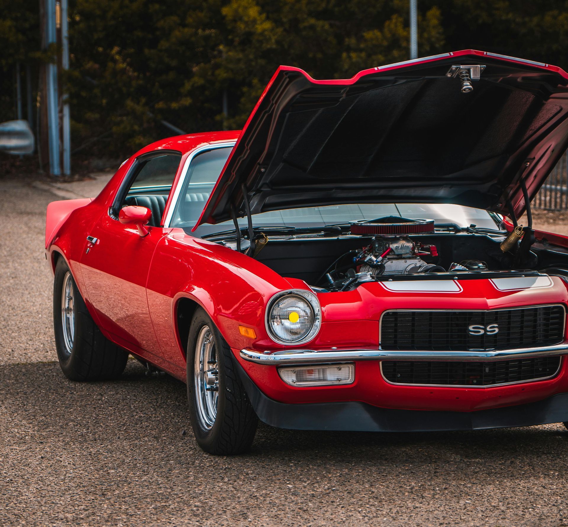 A classic red mustang with white strips — Central West Paint Supplies in Dubbo, NSW