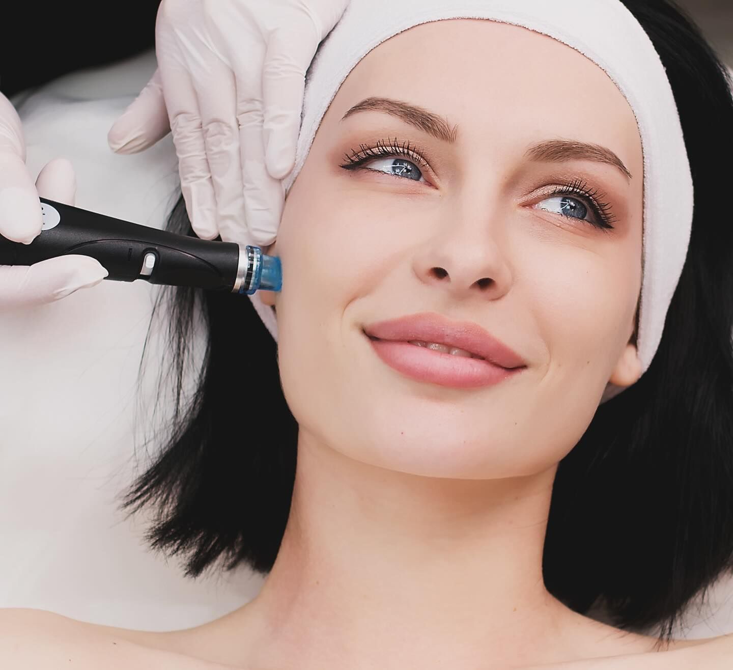 A Woman Wearing A Headband Is Getting A Facial Treatment — Chez Belle Skin Care & Beauty Centre in Pimlico, QLD