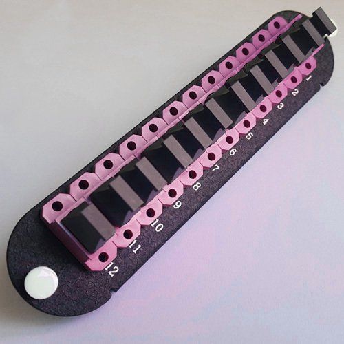 A black and pink item with numbers 1 through 10 on it