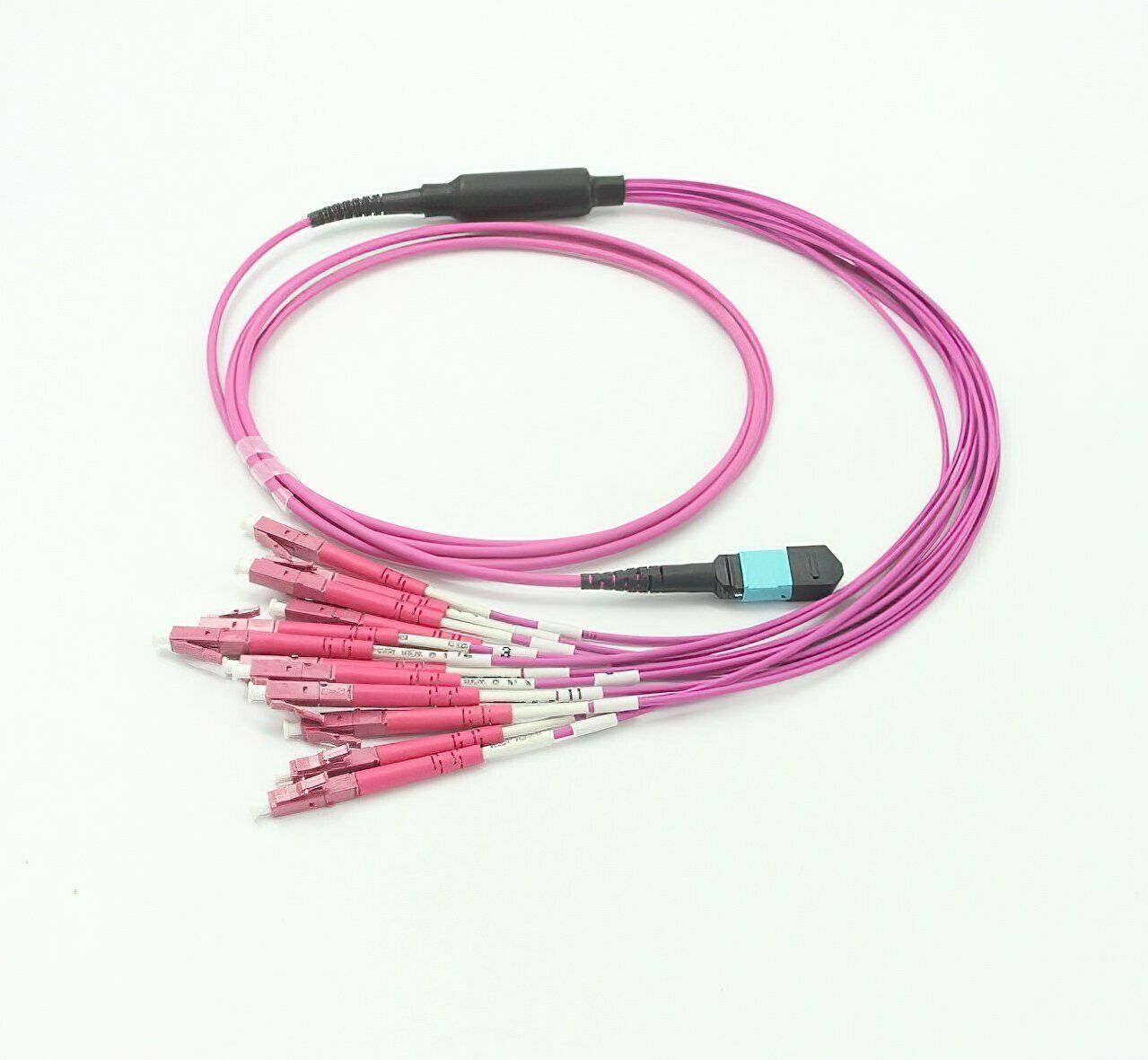 A bunch of pink cables with connectors on a white surface.