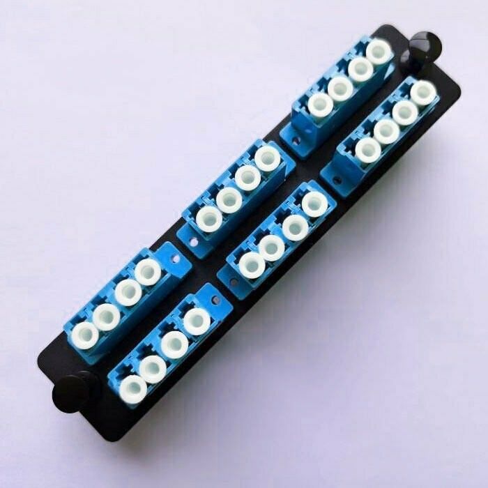 A black box with a bunch of blue connectors on it