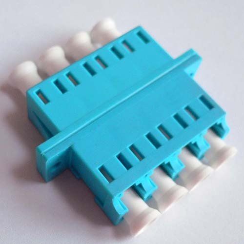 A close up of a blue and white connector on a white surface