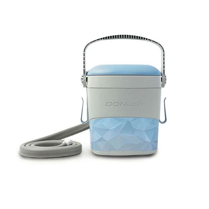 Portable blue and gray cooler with handle and shoulder strap on a white background