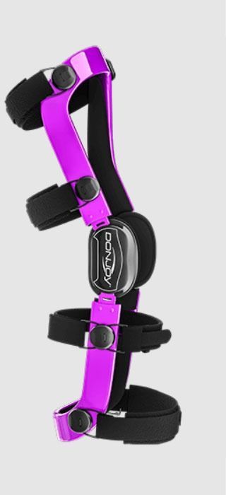 Black and purple knee brace with adjustable straps and metal hinges on a white background
