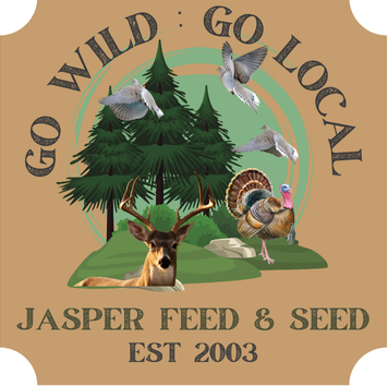 A logo for jasper feed and seed with a barn and silo