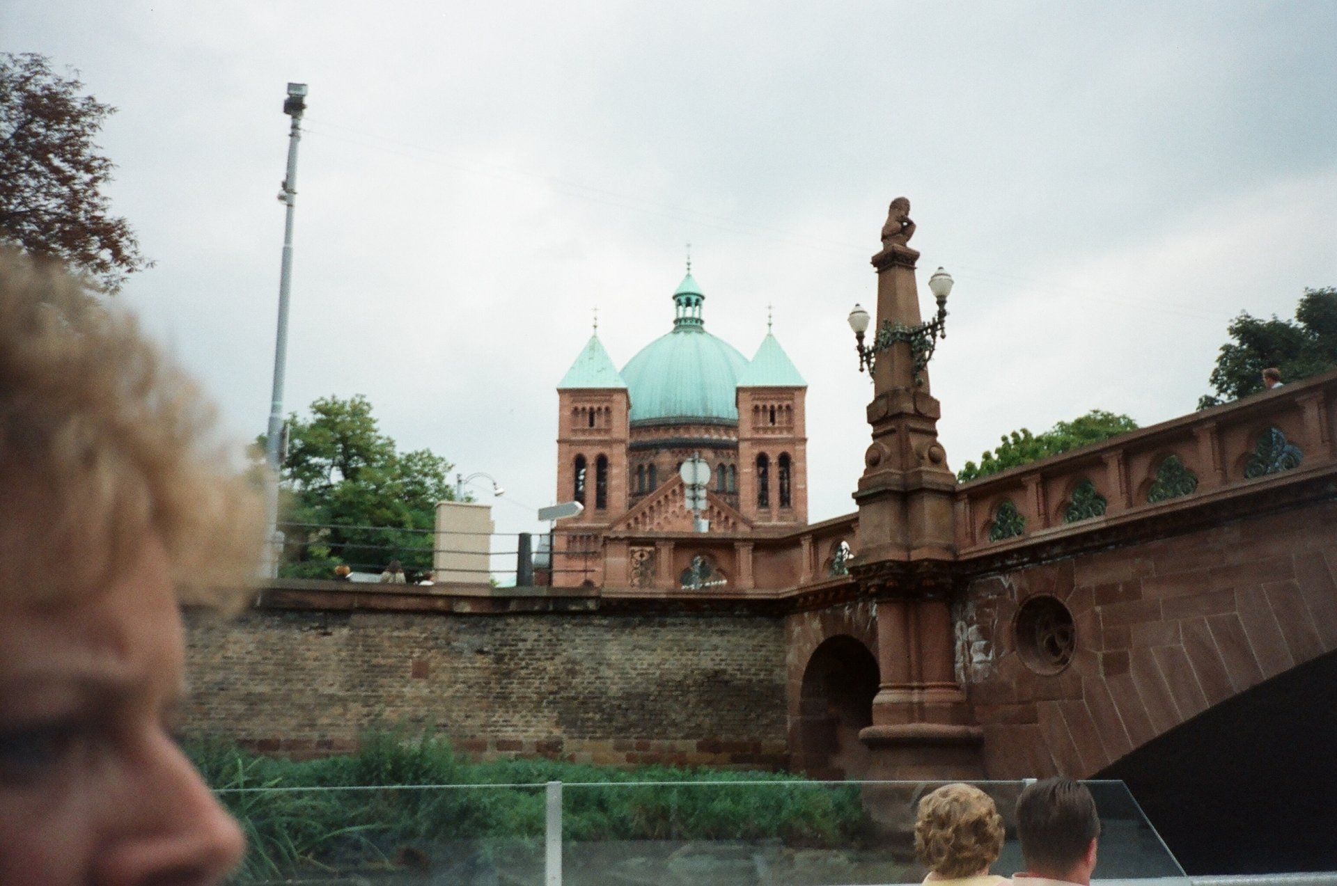 A person is looking at a building with a dome on top of it