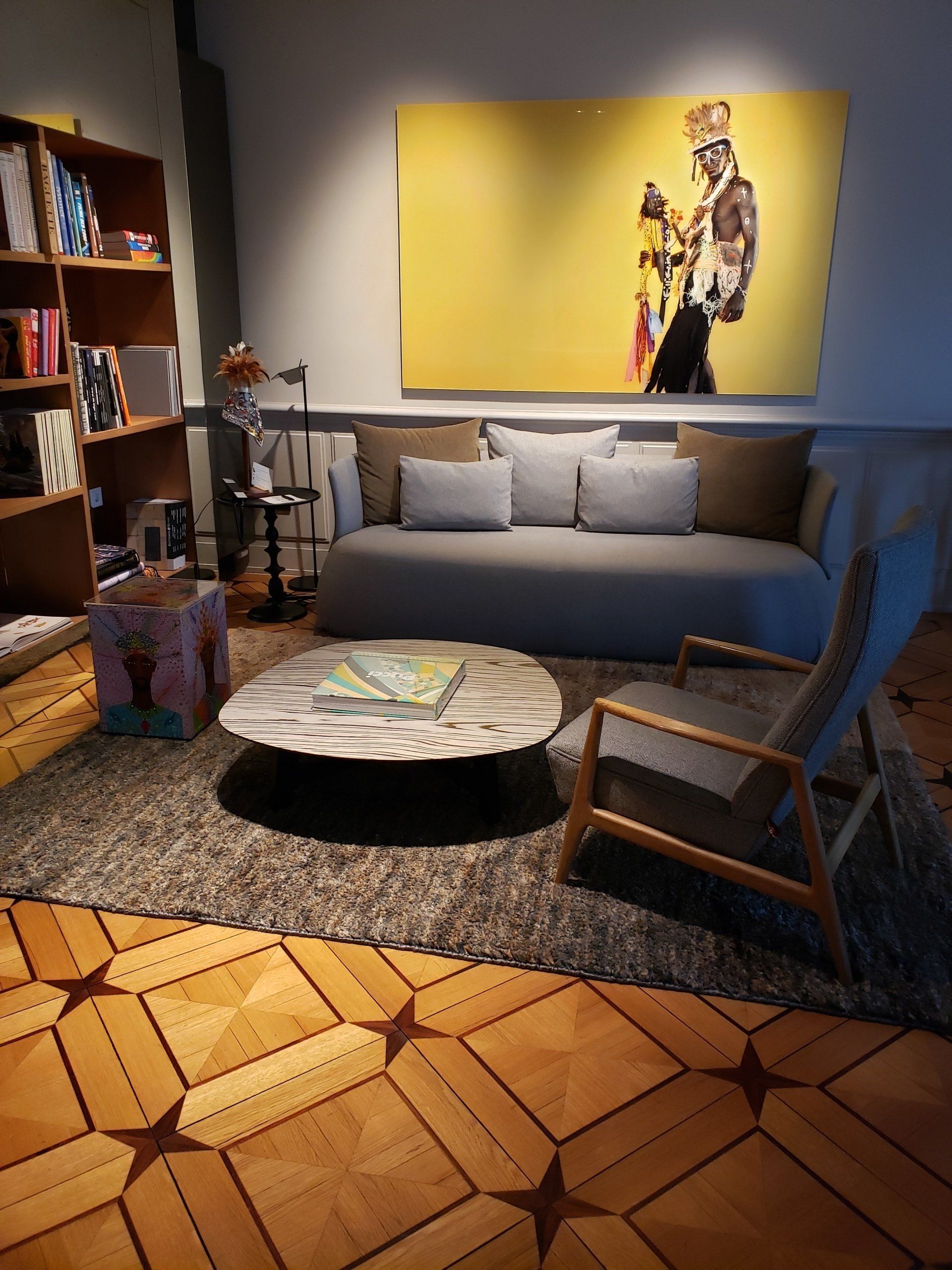 A living room with a couch a chair and a coffee table