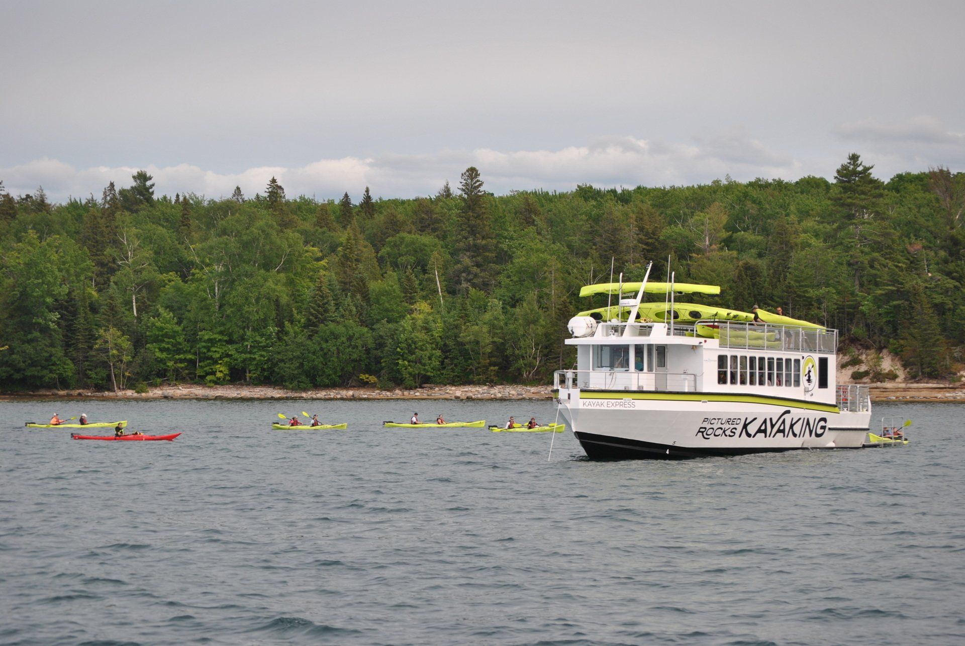 A boat that has the word kayak on it