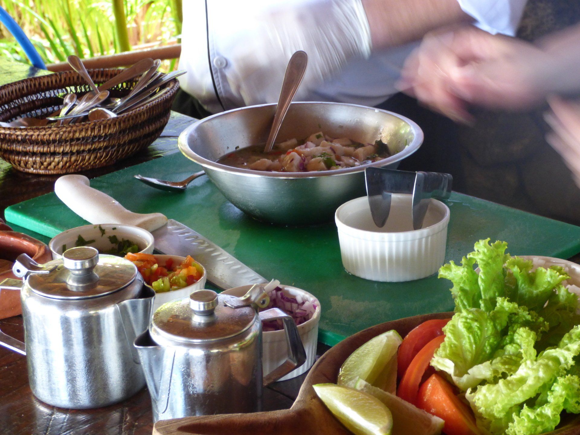 A cutting board with a bowl of food on it