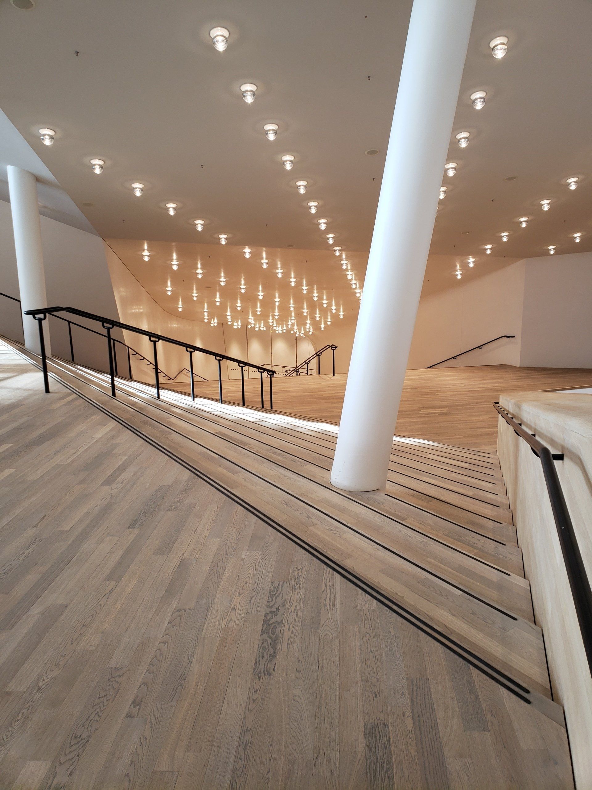A staircase leading up to a large room in a building