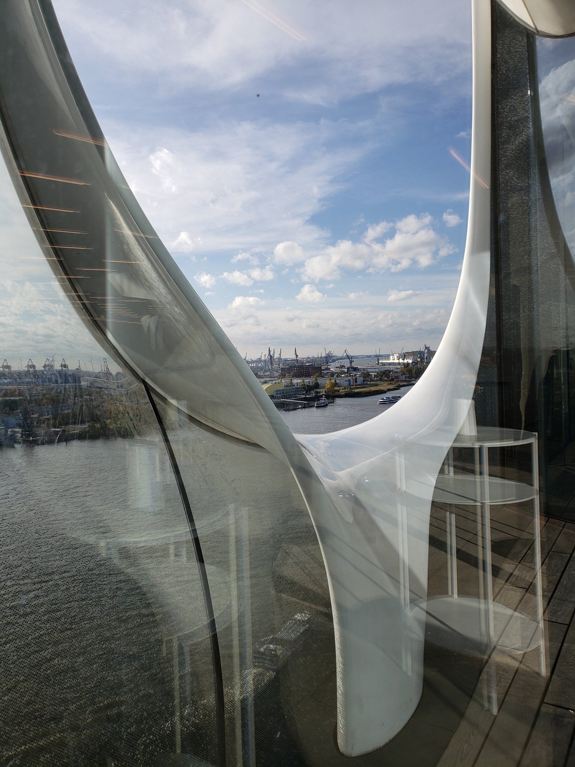 A window with a view of a city and a body of water