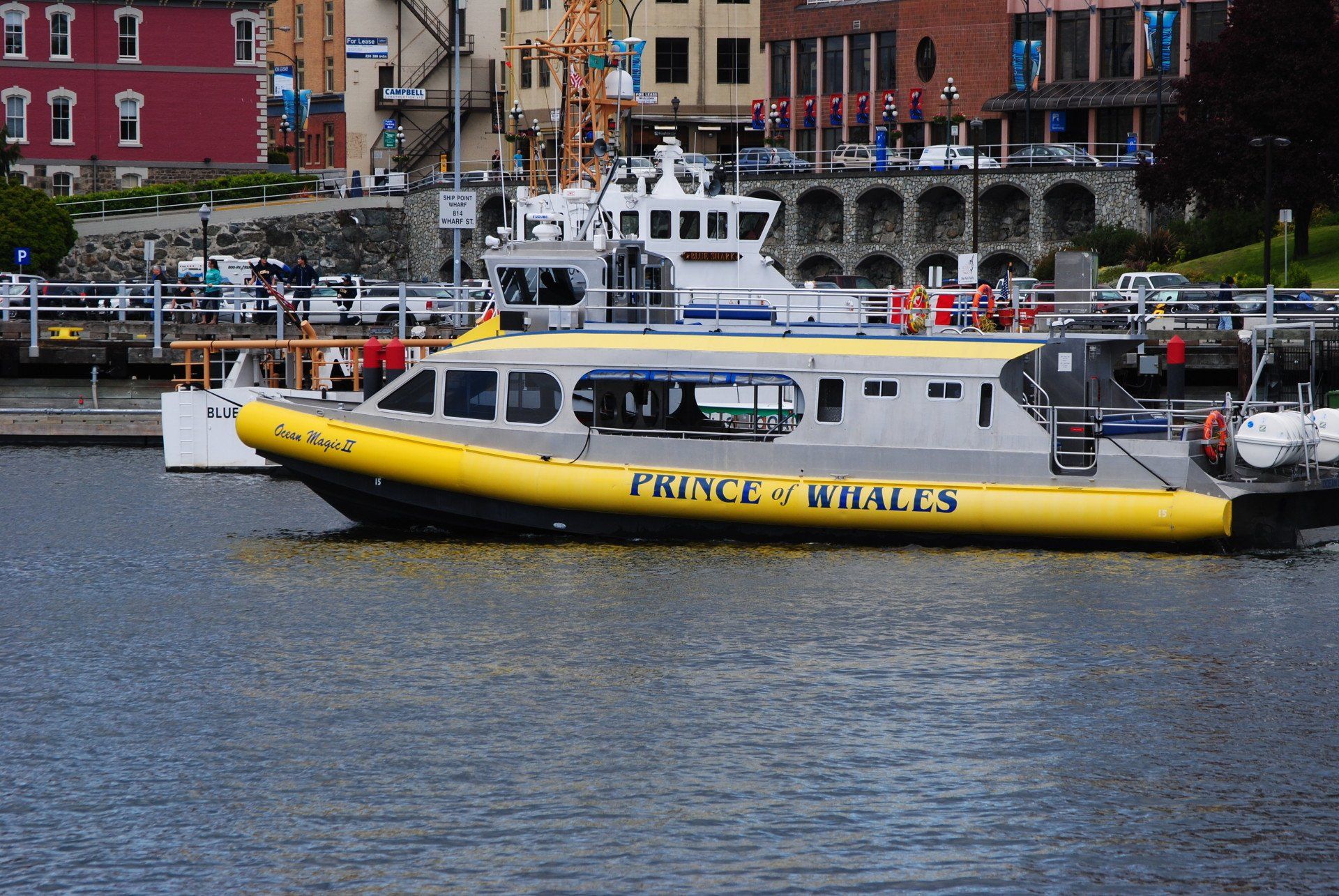 A yellow boat with the name prince on it
