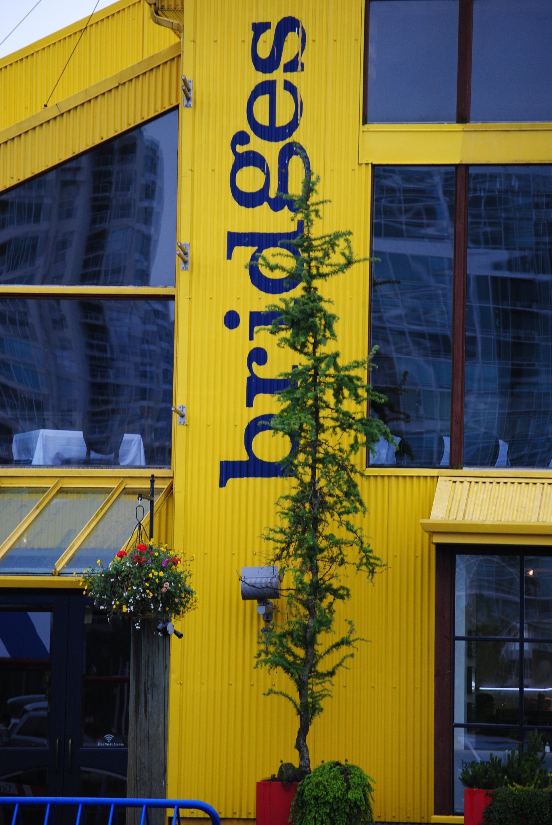 A yellow building with a sign that says bridges