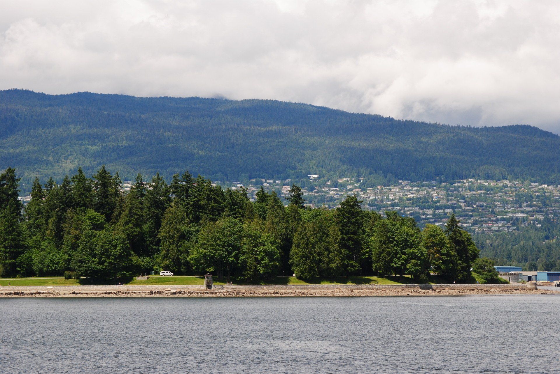 A large body of water with mountains in the background