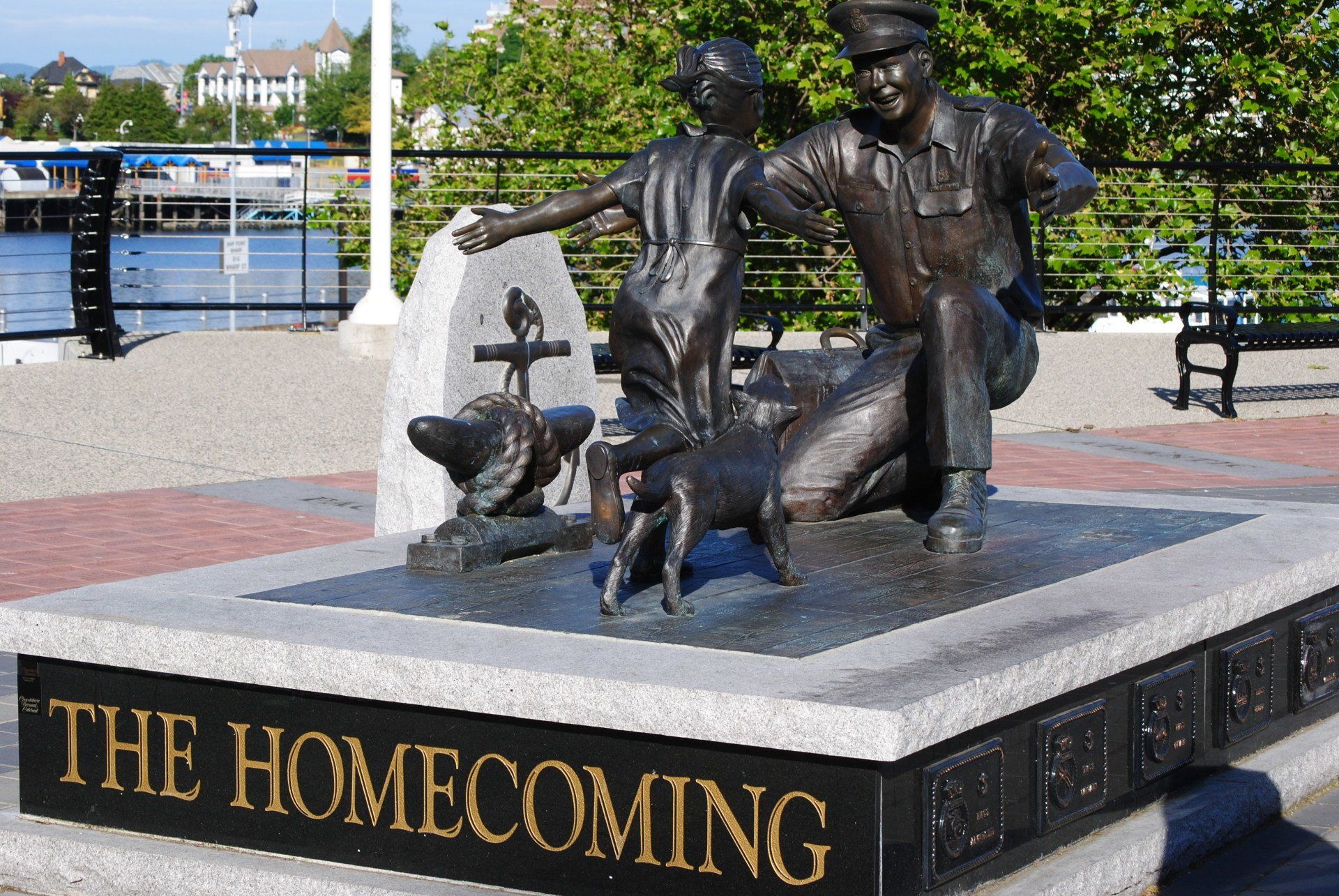 A statue with the words the homecoming on it
