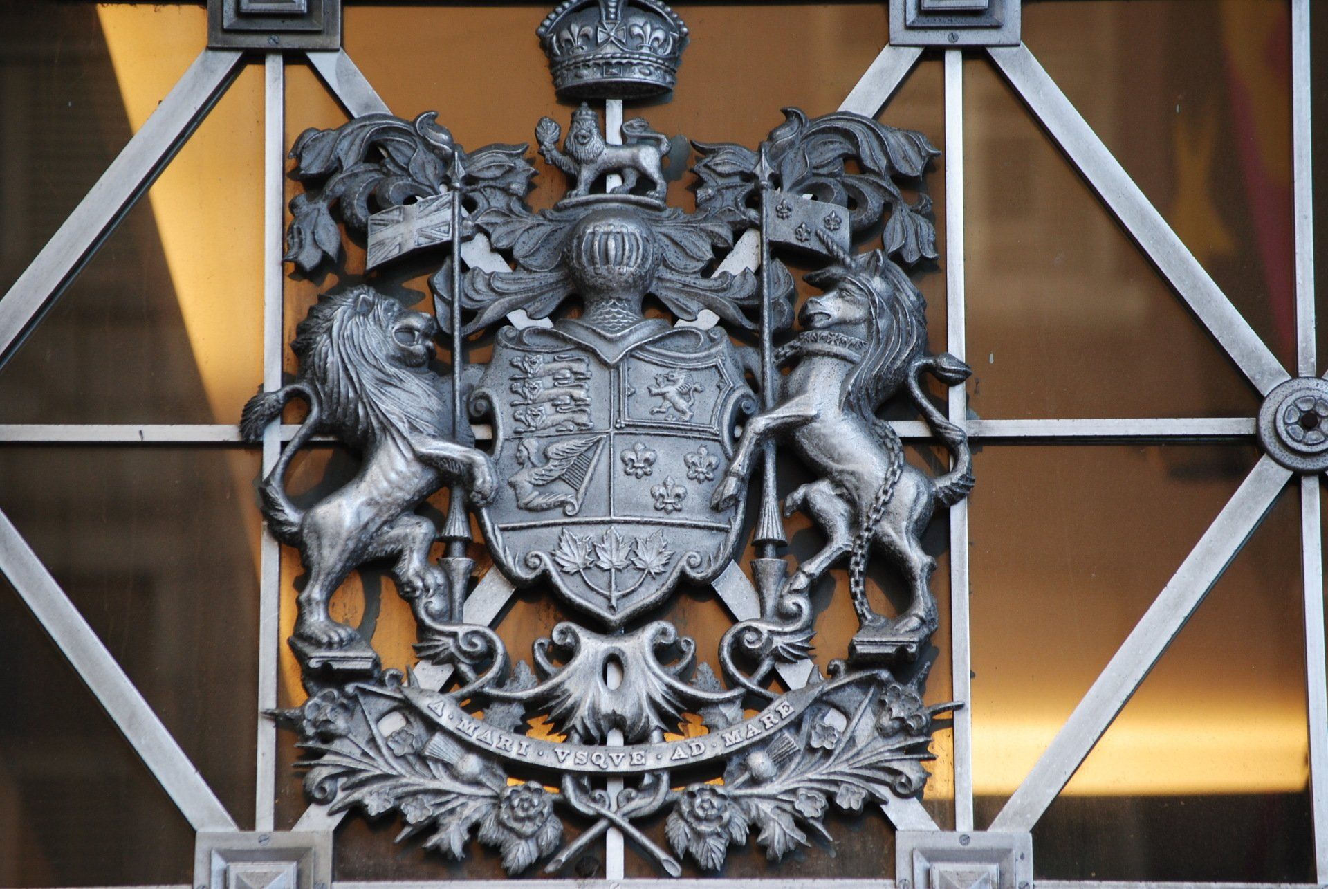 A close up of a coat of arms on a window