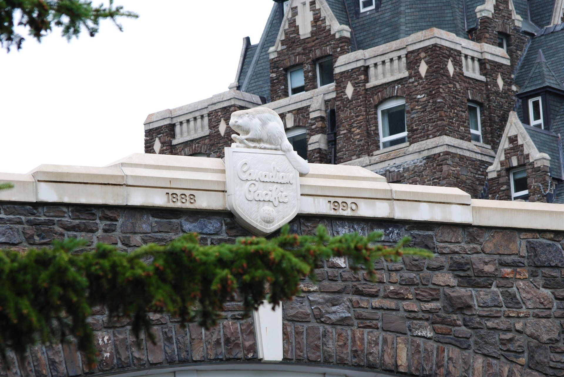 A stone wall with a coat of arms on it