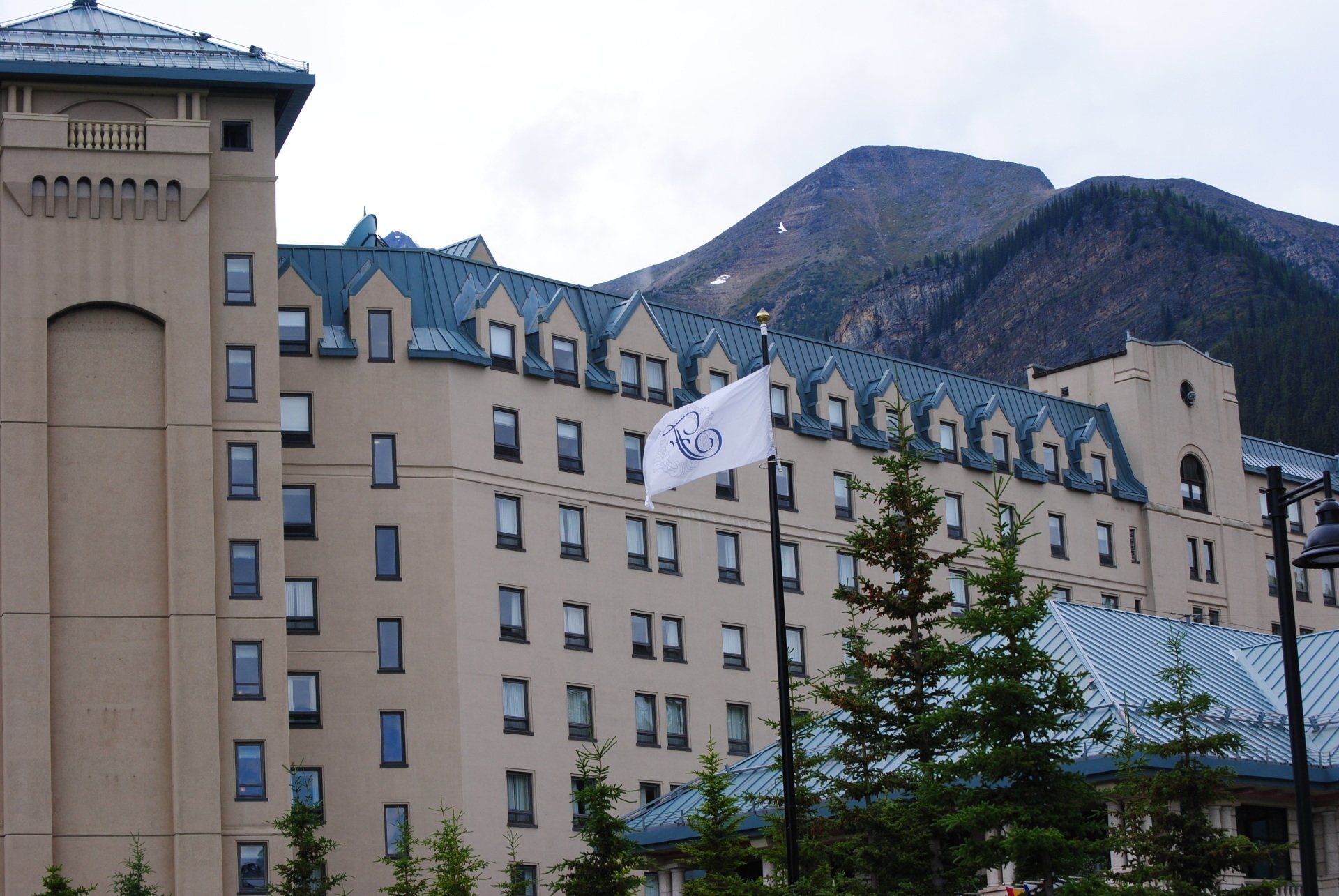 A large building with a flag in front of it