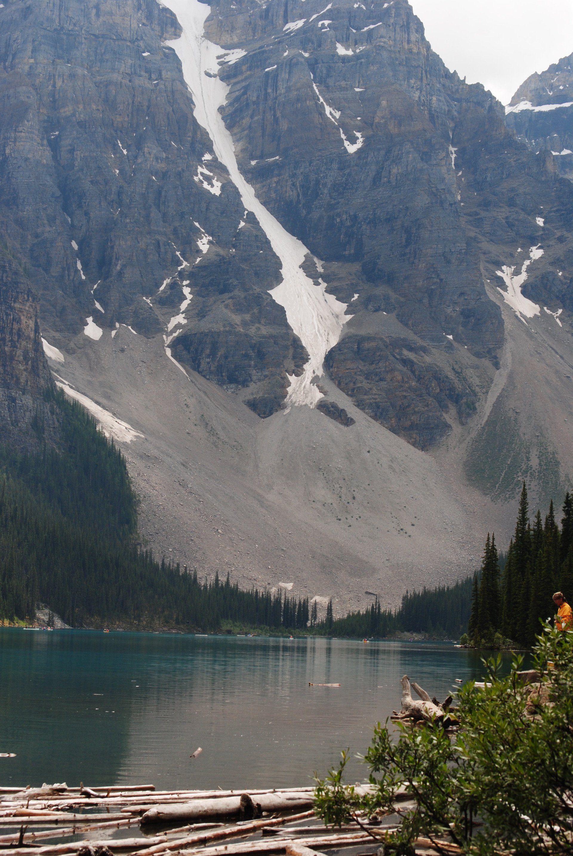 A lake with a mountain in the background