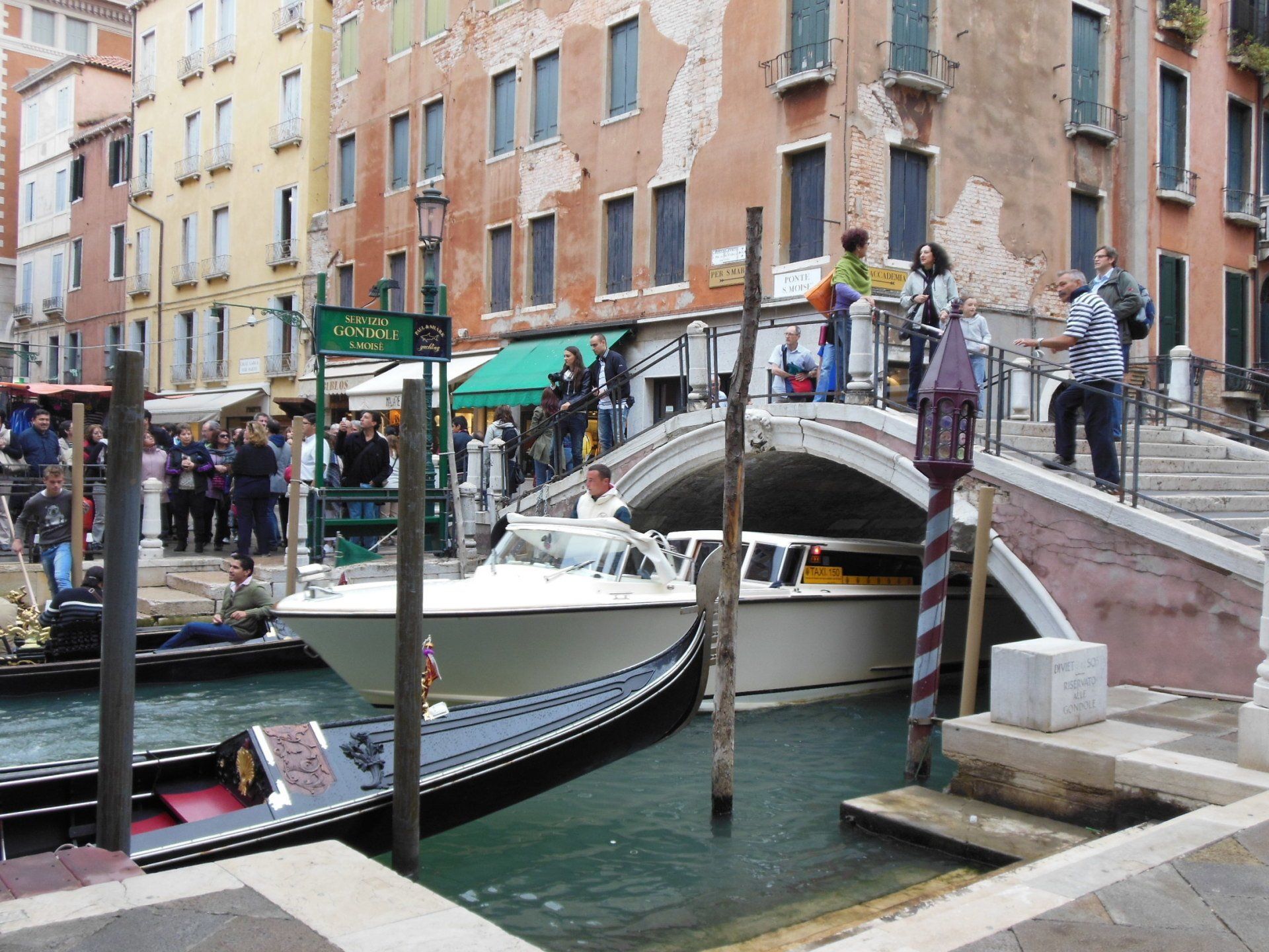 A bridge over a body of water with boats in it