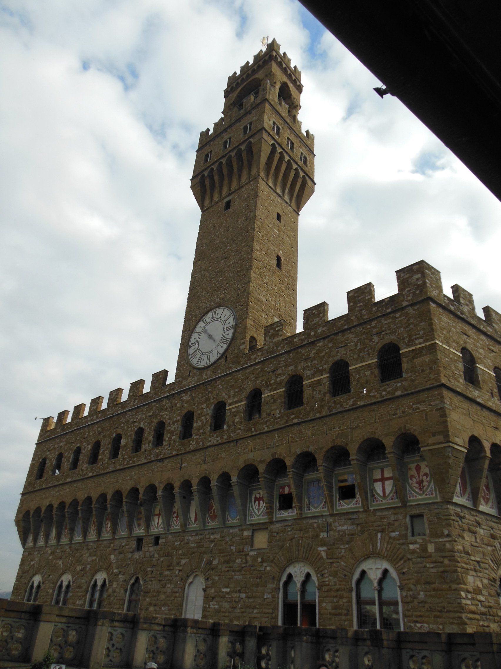 A large brick building with a clock on top of it