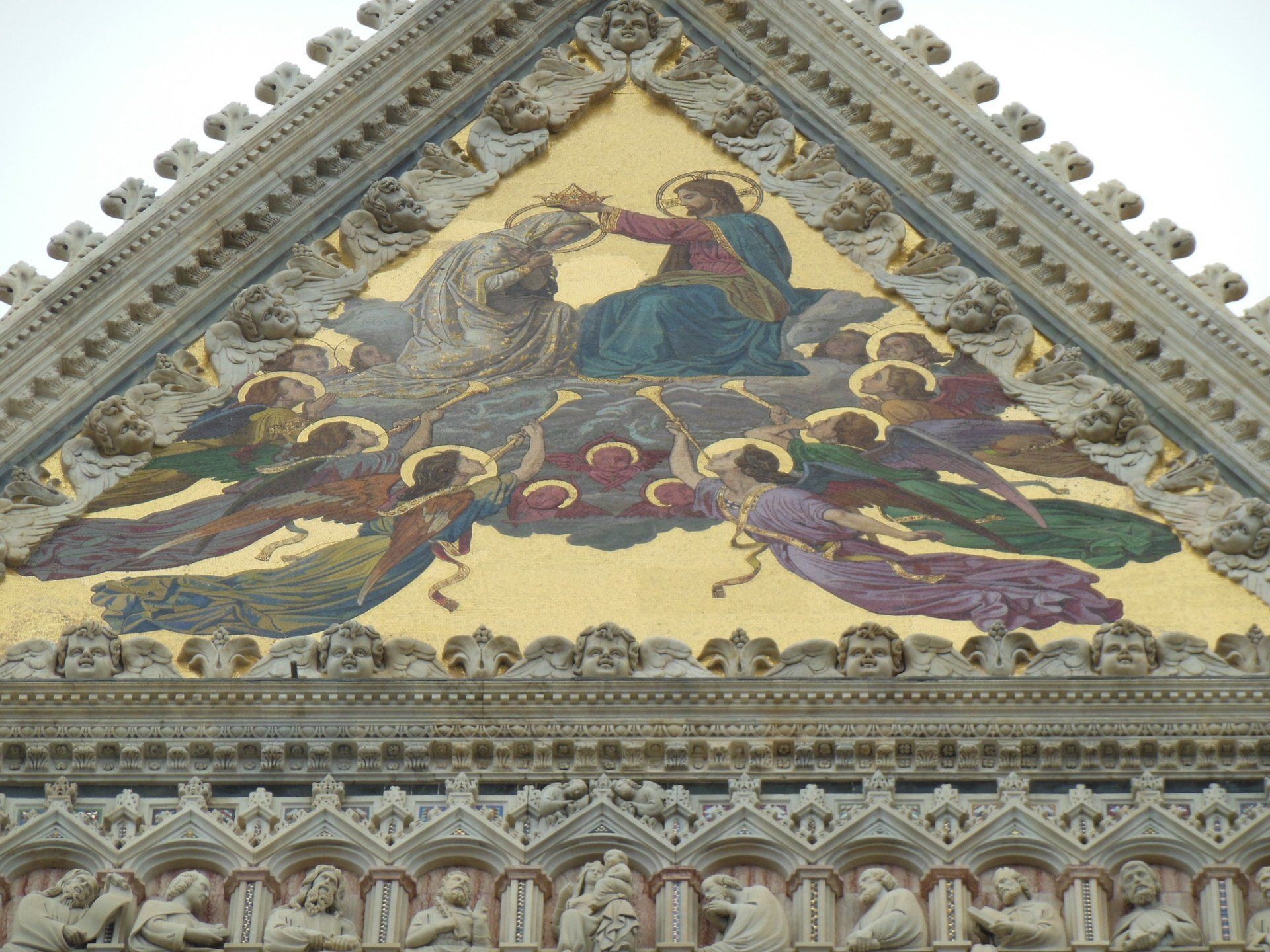 A building with a painting of jesus and angels on it