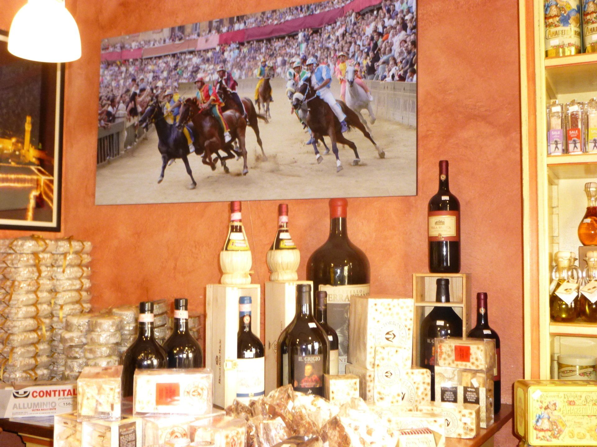 Several bottles of wine are on display in a store