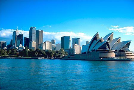A city skyline with the opera house in the foreground