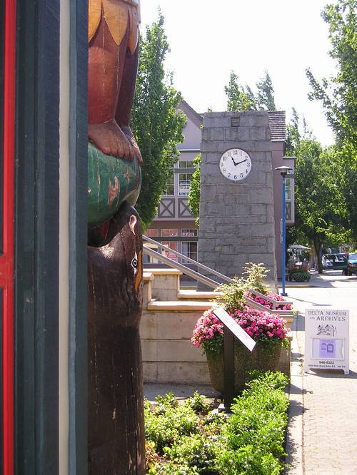A clock on the side of a building shows the time as 10:10