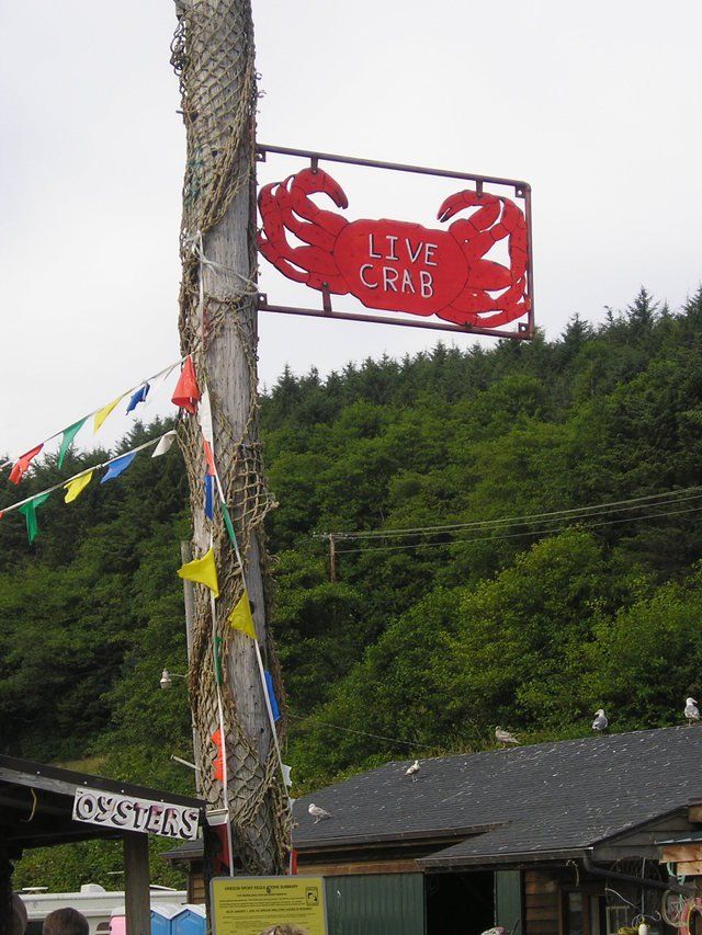 A sign on a pole that says love crab
