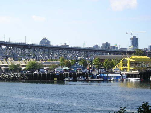 A bridge over a body of water with boats in the water