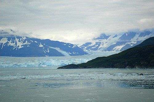 A large body of water with mountains in the background