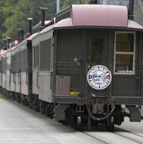 A train with a sign that says white pass union route