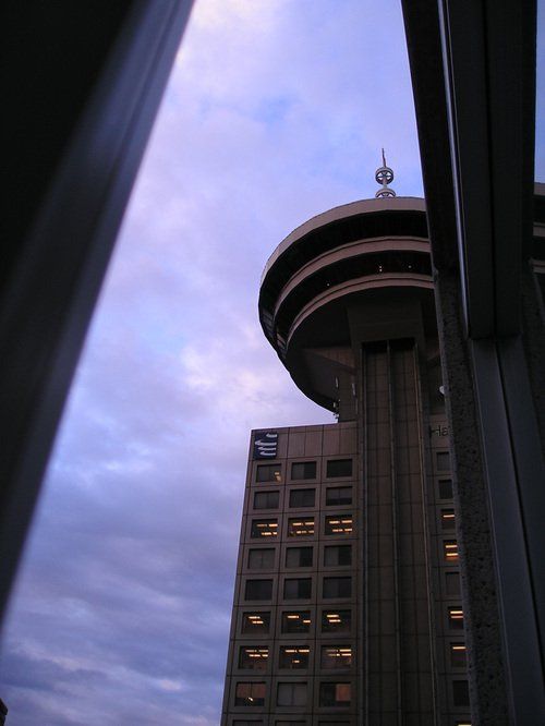 Looking up at a tall building with the word cn on it