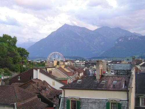 A view of a city with mountains in the background