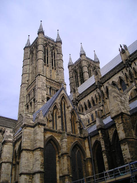 A large stone building with a very tall tower