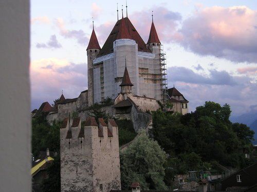 A castle on top of a hill covered in scaffolding