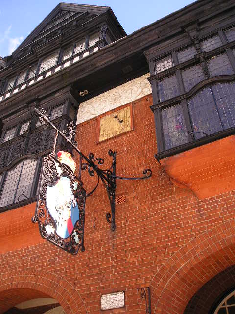 A large brick building with a clock on the side