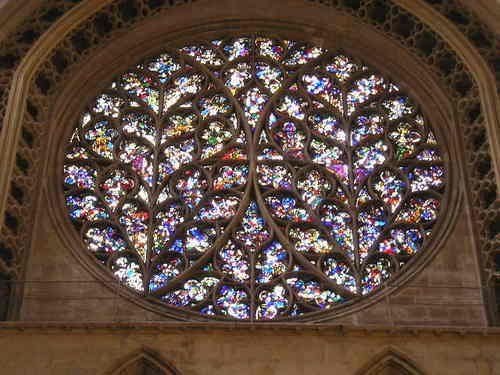 A close up of a stained glass window in a church.