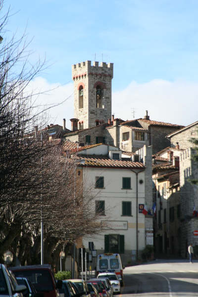 A small town with a tower in the middle of it