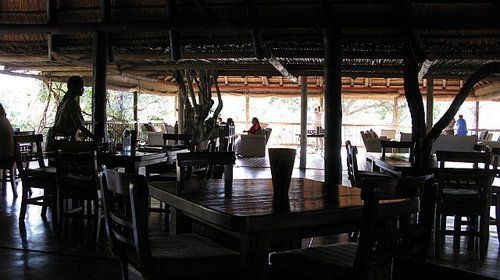A restaurant with a lot of tables and chairs