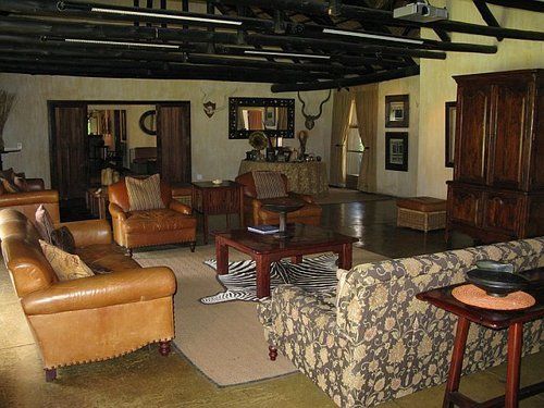 A living room with a lot of furniture and a table