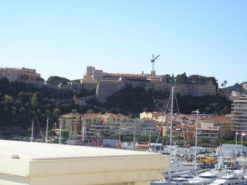 A view of a city with a castle in the background