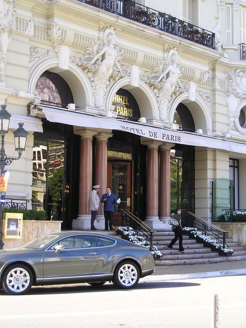 A car is parked in front of the hotel de paris