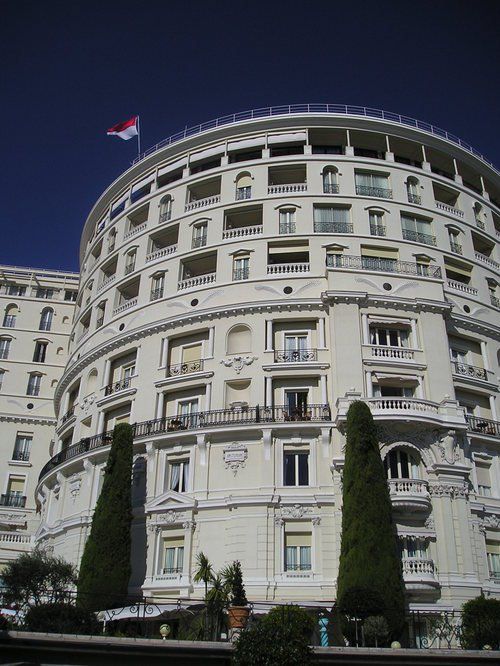 A large building with a flag on top of it