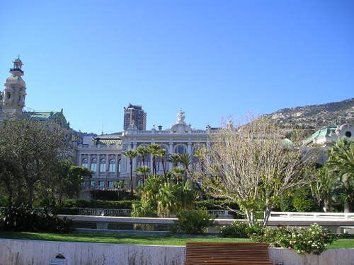 A park with a large building in the background