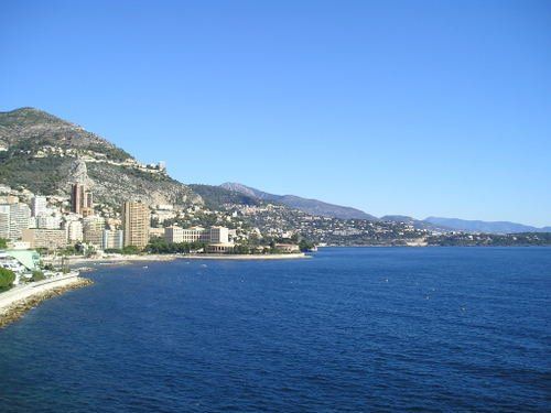 A large body of water with mountains in the background