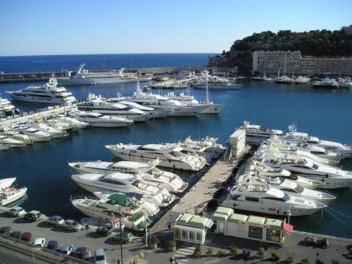 A large number of boats are docked in a harbor