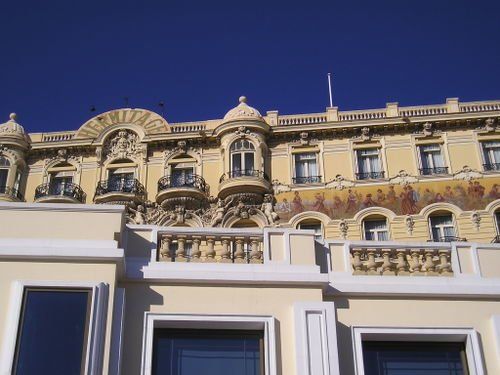 A large building with a blue sky in the background
