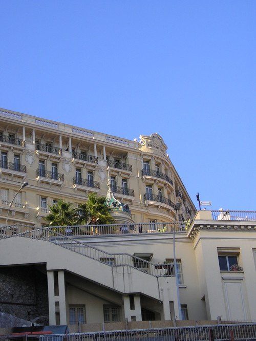 A large building with a blue sky in the background